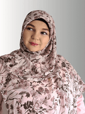 Woman wearing  pastel pink hijab with brown floral print