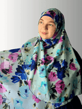 Woman showing a hijab in vibrant floral color print