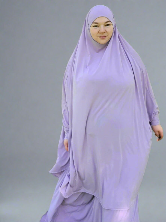Muslim two piece prayer set in lavender color. Top is  knee length,  flowy with sleeves one size fits most. Elastic skirt custom made to fit. Maida's Hijab World 