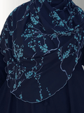 A serene handmade hijab with delicate teal floral vines on a navy background, exuding elegance and comfort. Made from premium jersey fabric, ideal for both casual and formal wear.
