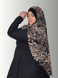 Animal print scarf with earthy tone and a bold black solid contrast color ,sophisticated muslim woman 