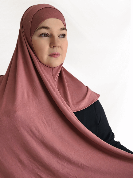 Soft rose-toned instant jersey hijab named Rosewood Blush, lightweight fabric with matching undercap, displayed on a neutral backdrop.