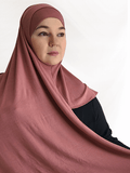 Soft rose-toned instant jersey hijab named Rosewood Blush, lightweight fabric with matching undercap, displayed on a neutral backdrop.