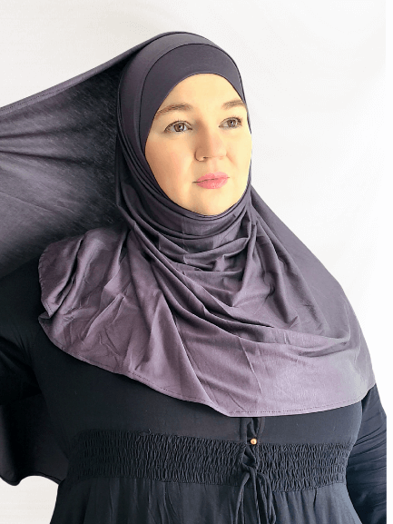 Charcoal gray instant jersey hijab shawl with a fluid drape and matching undercap, styled on a neutral background.
