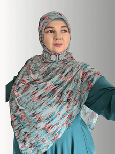 Woman wearing. Hijab in multi color print 