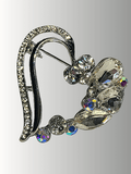 Heart-shaped rhinestone hijab brooch with floral detailing.