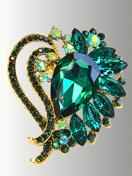Green crystal hijab brooch with floral gold-tone accents, perfect for scarves.
