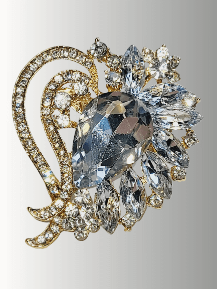 Clear crystal hijab brooch with a floral gold-tone setting, perfect for weddings and Eid.