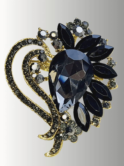 Black crystal hijab brooch with gold floral detailing, perfect for elegant wear.