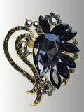 Black crystal hijab brooch with gold floral detailing, perfect for elegant wear.
