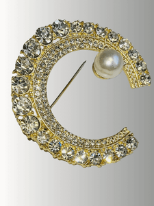Gold crescent hijab brooch with clear rhinestones and pearl detail.