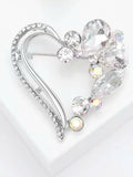 Heart-shaped rhinestone hijab brooch with floral detailing.